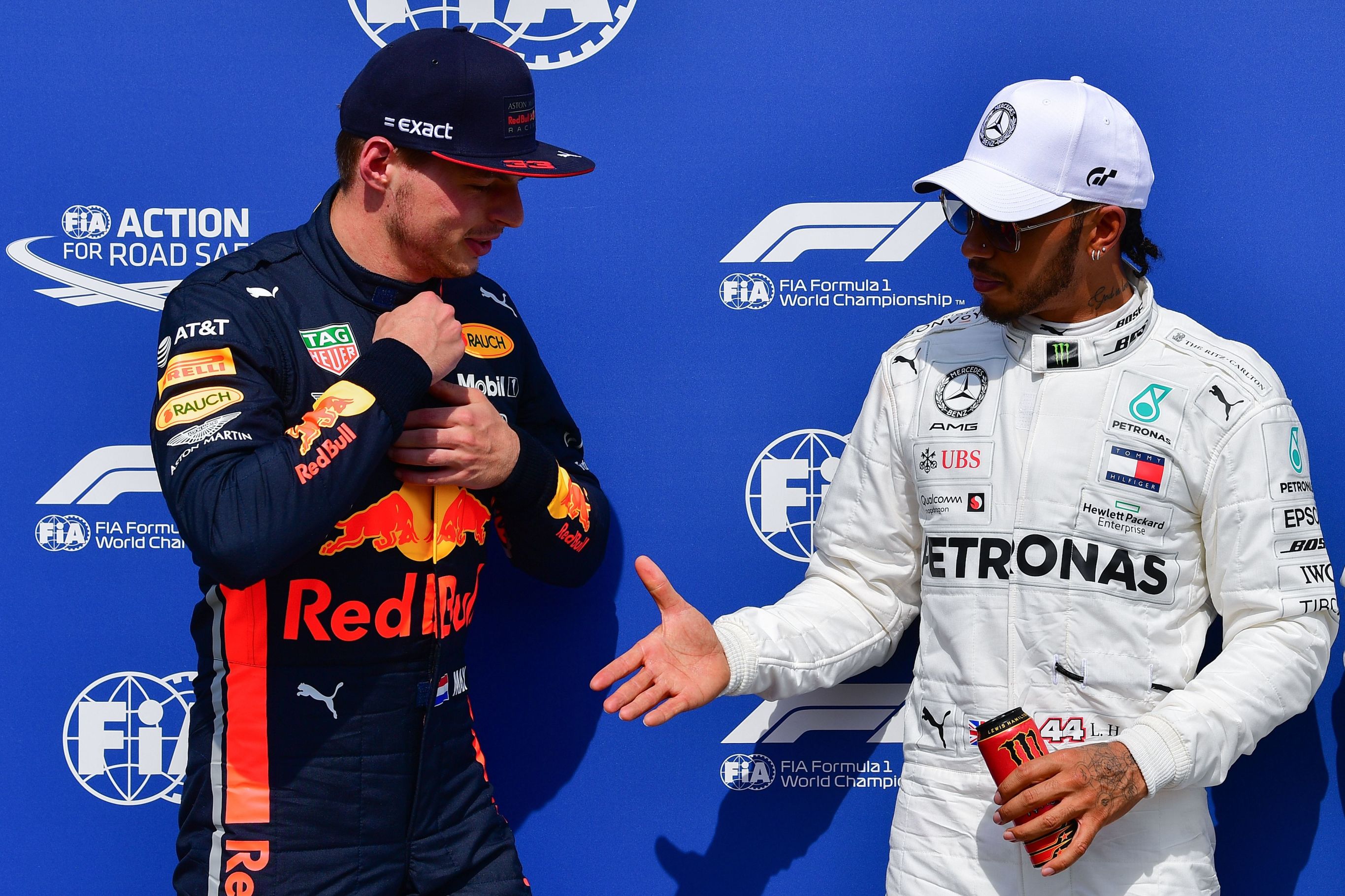 Max Verstappen and Lewis Hamilton shaking hands after the last race of the 2019 season.